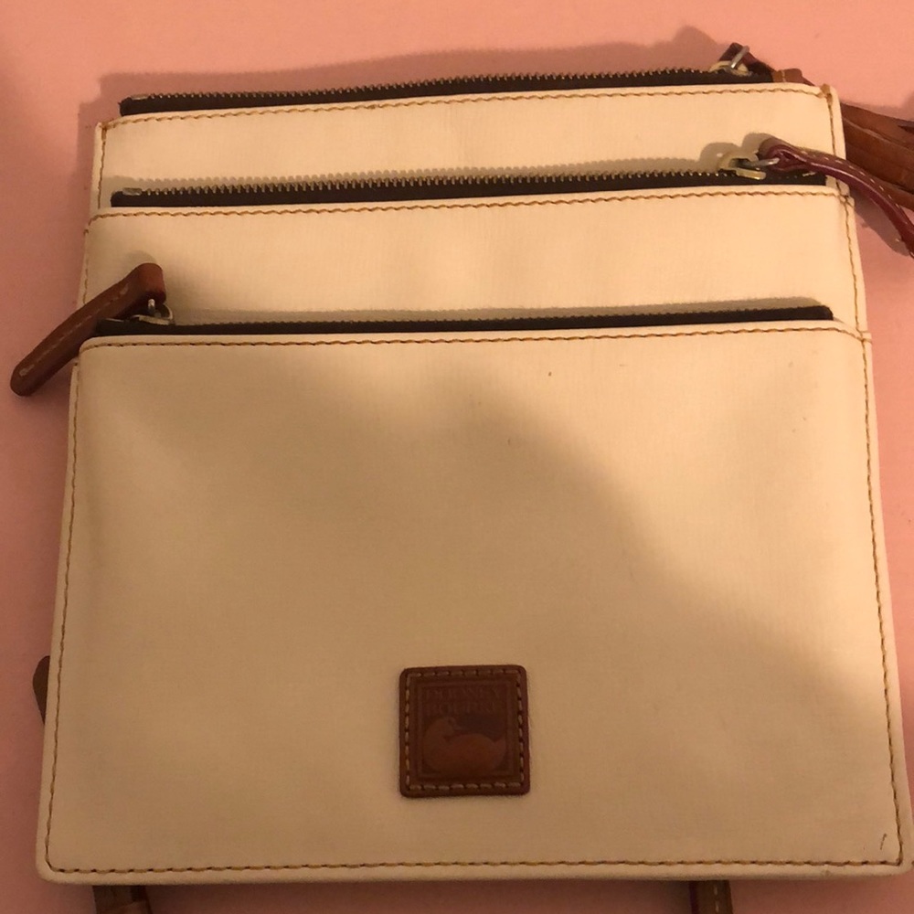 Dooney and Bourke cream colored cross body